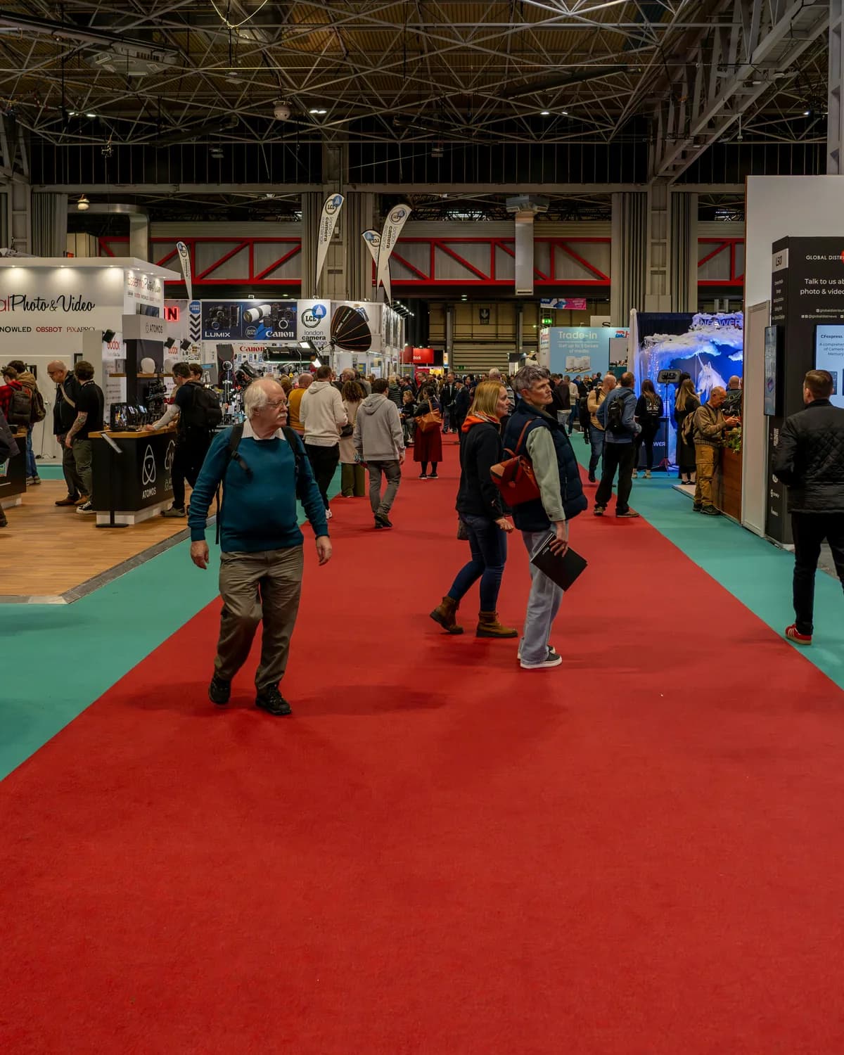 Visitors on the red carpet of a caravan show hall