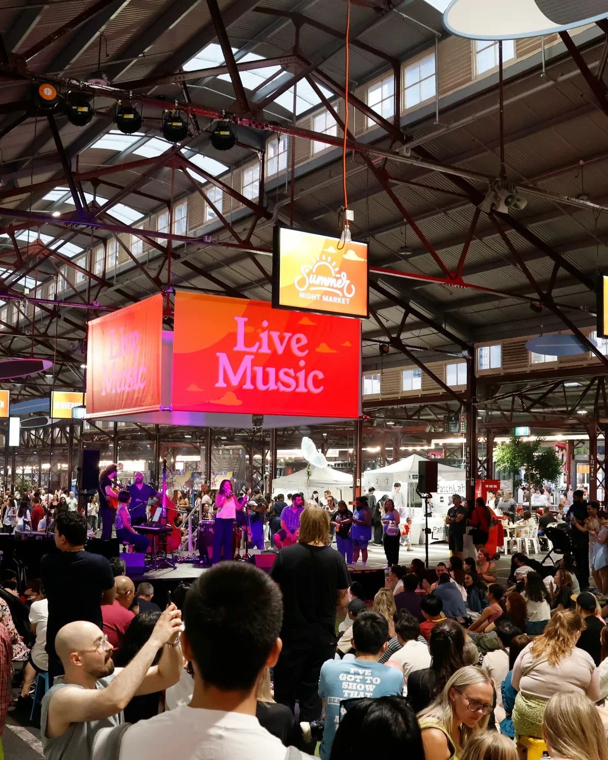 A packed food festival in a heritage market hall